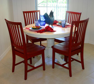 white kitchen table and four wooden chairs